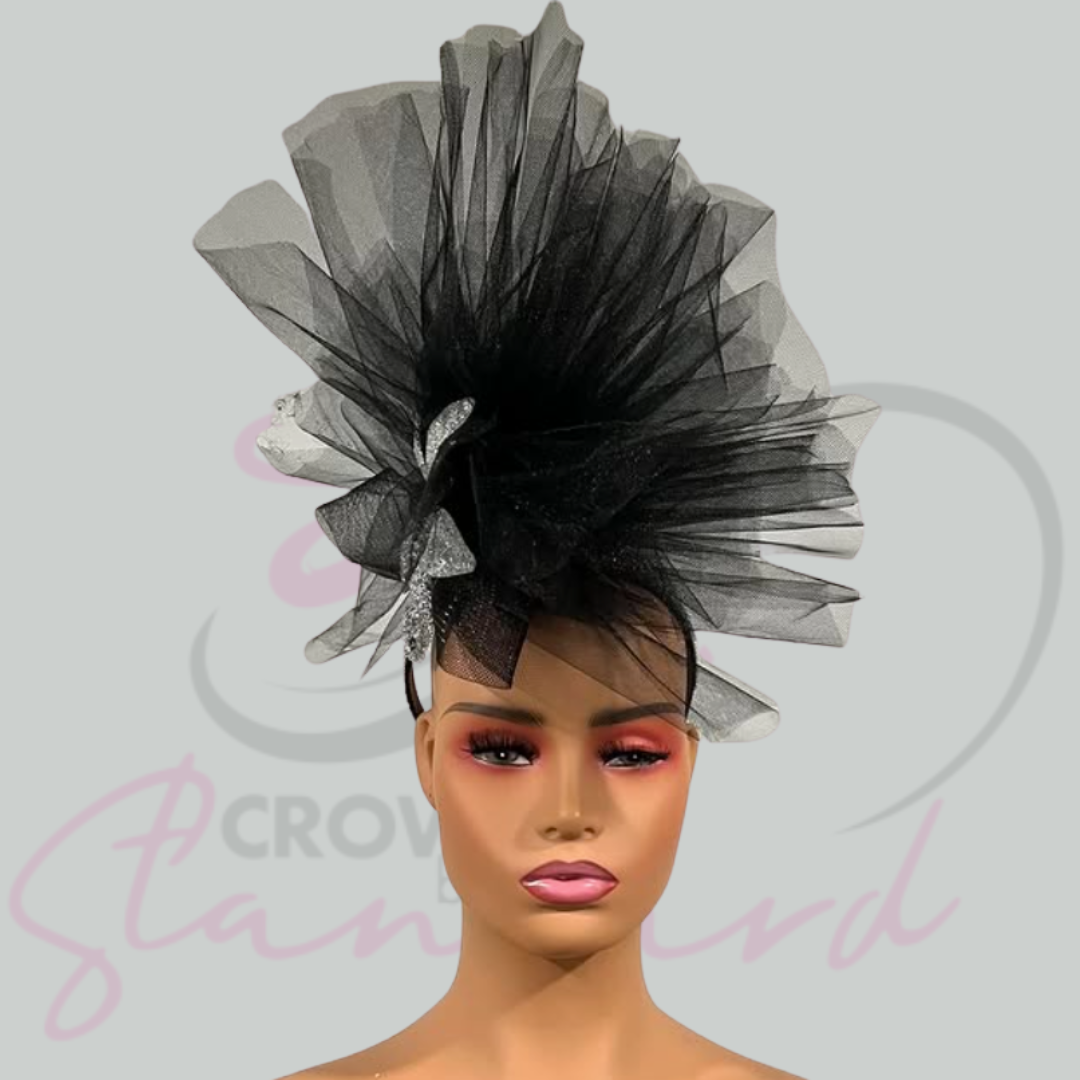 Beautiful black and silver fascinator accented with silver!