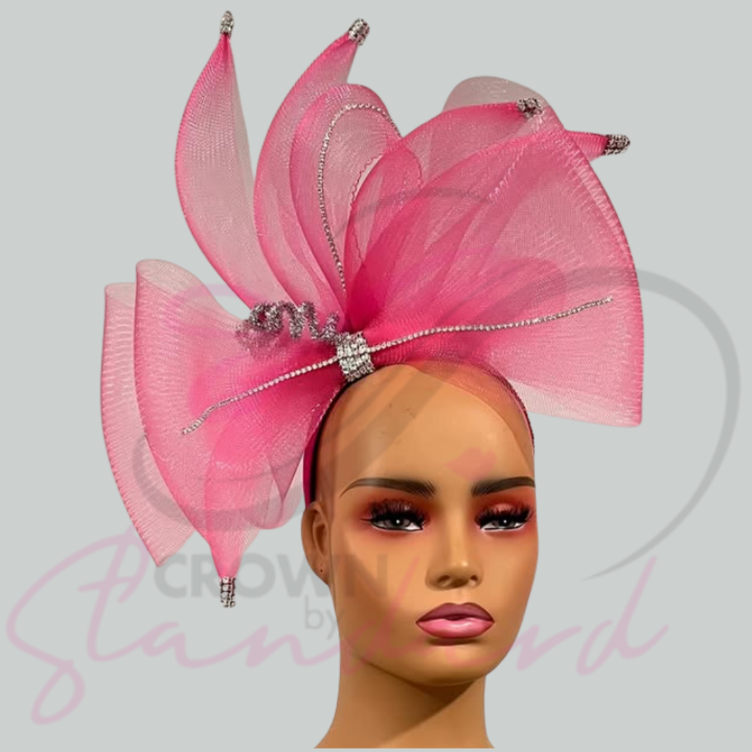 Pink fascinator with crinoline design detail and rhinestones!