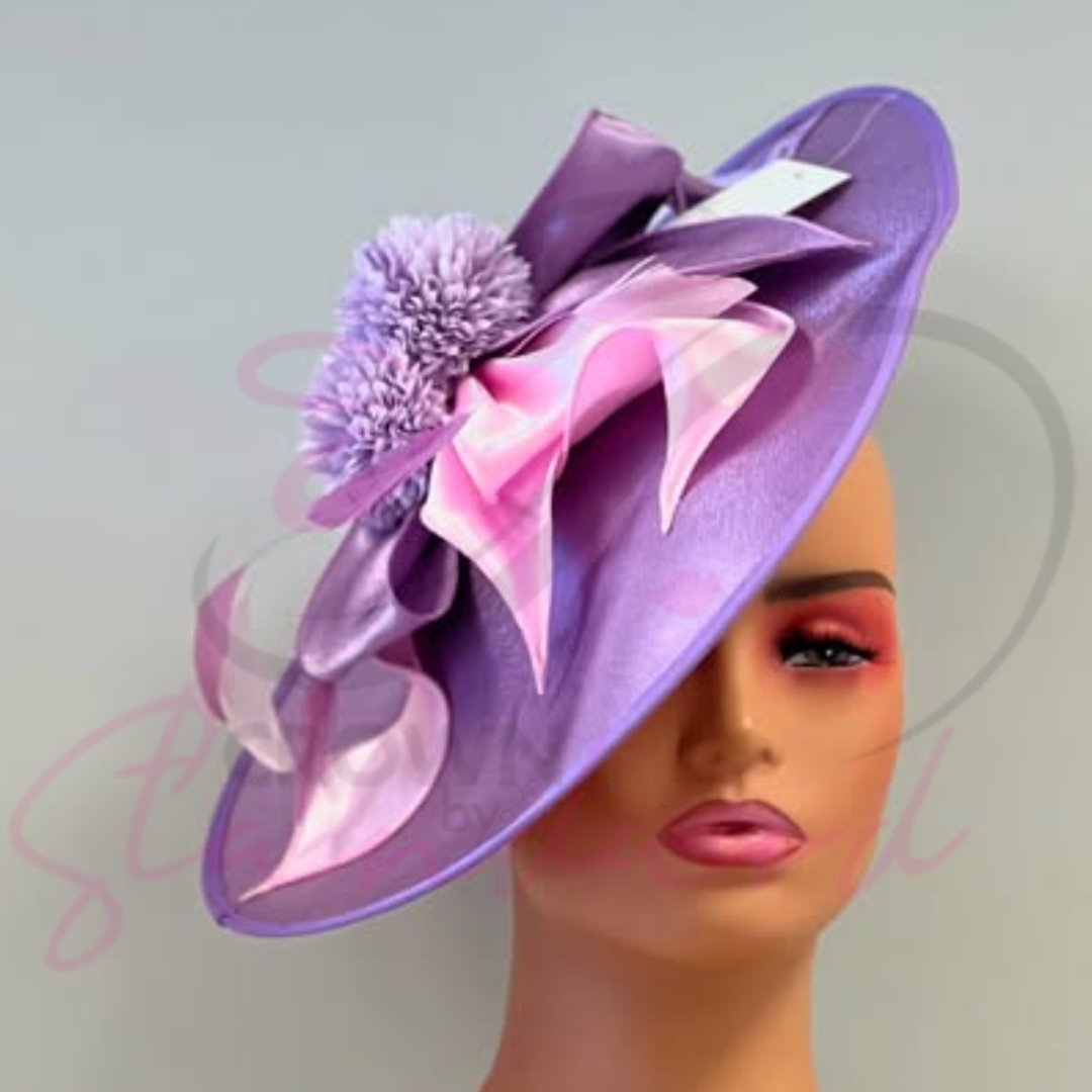 Lavender color fascinator with a flower!