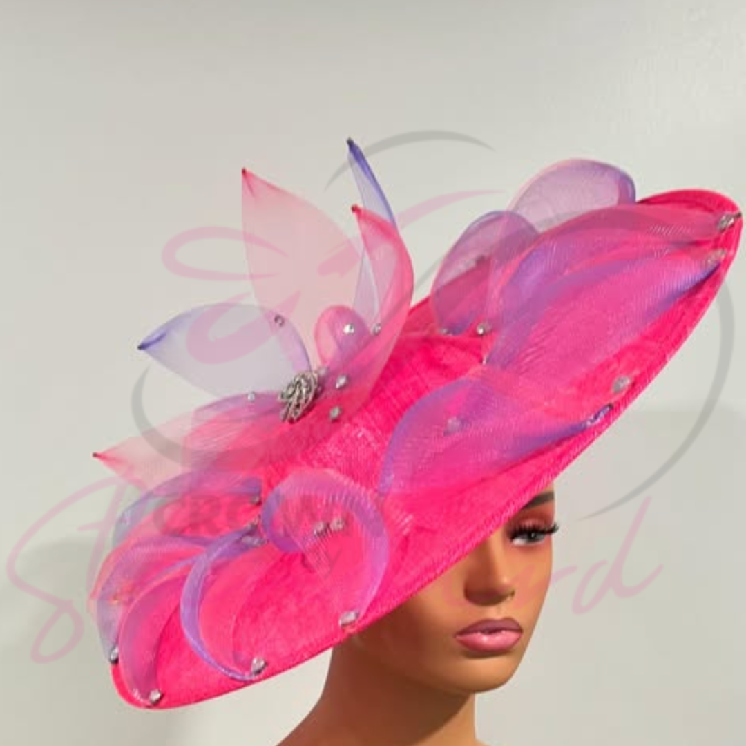 Pink fascinator features a swirl of lavender and pink crinoline, accented with a button and sparkling embellishments.