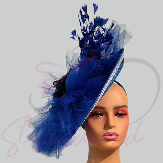 Royal blue fascinator with netting, feathers, and a flower!