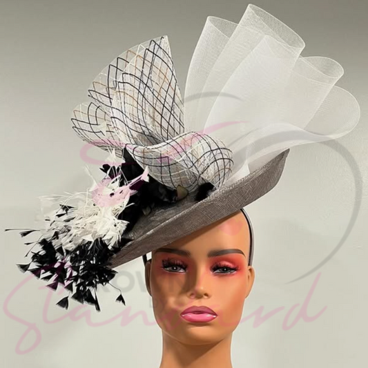 Gray fascinator with white and multi colored crinoline, black and white feathers and a flower!