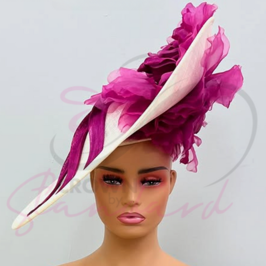 White fascinator with a huge pink flower, and a gorgeous design going down the front!