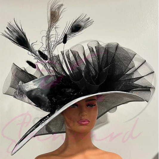 Gray hat with black crinoline, black and gray feathers, black flower, and other trimmings!