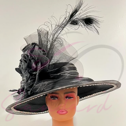 Uniquely designed hat with crinoline, rhinestones, a huge flower, and feathers
