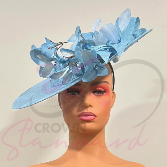 Light blue saucer shaped fascinator with a large bow and flowers!