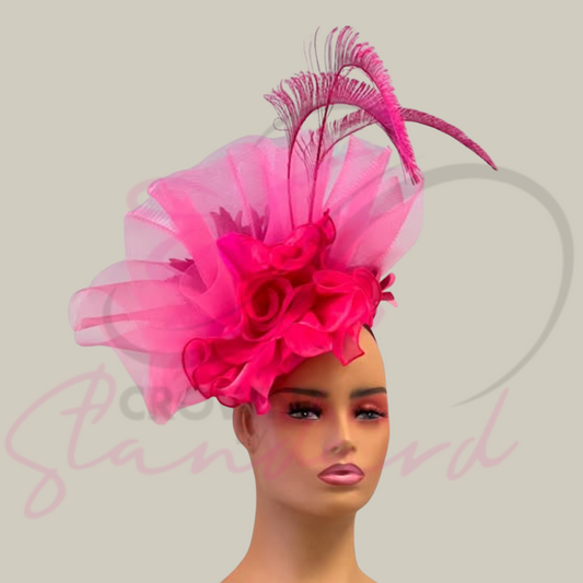 Pink fascinator with a feather and flowers!