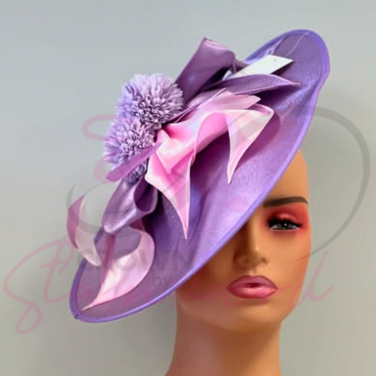 Lavender color fascinator with a flower!