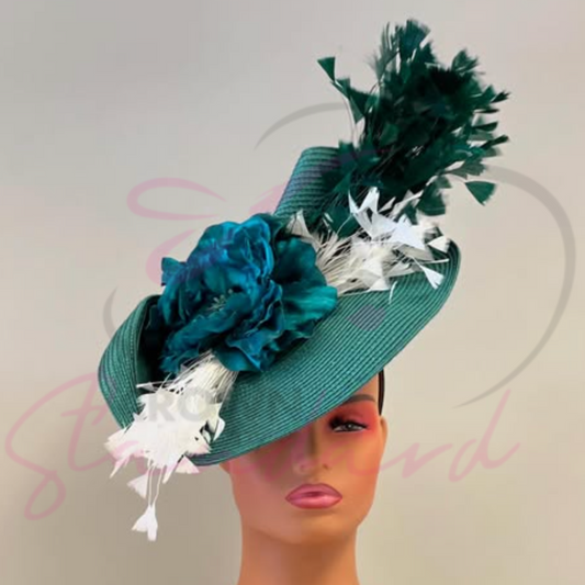 Green fascinator with a flower and feathers!