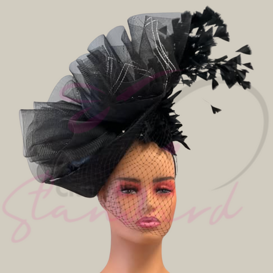 Black fascinator with silver and black crinoline, netting, a flower, and feathers!