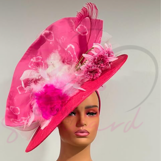 This gorgeous fascinator is a combination of the pink feathers, flowers, and crinoline  that stands out! Great choice!