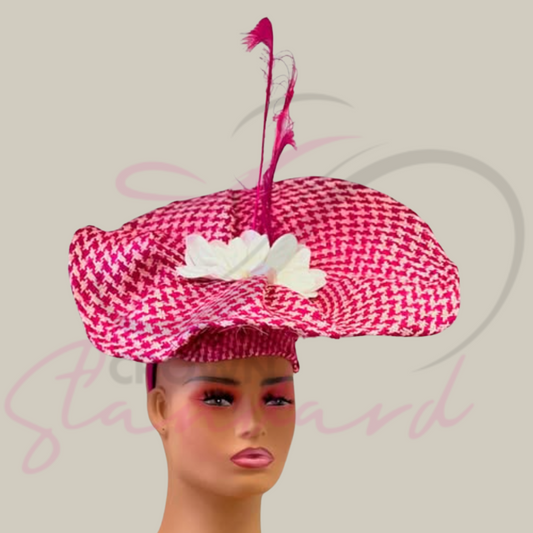 Pink and white Buntal fascinator with a white flower and feathers.
