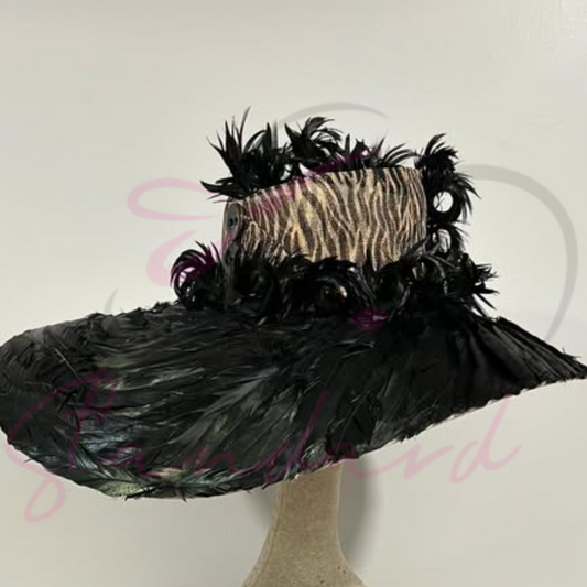 Tan hat with a leopard print crown and a black feathered brim!