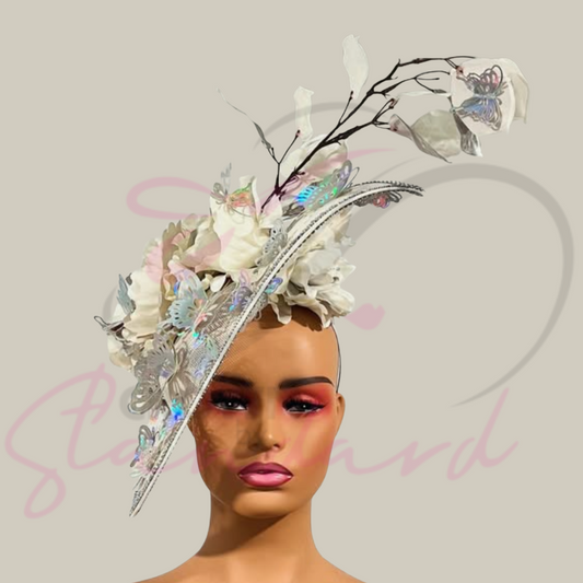 White fascinator with silver and white flowers that are surrounded by many beautiful silver butterflies!