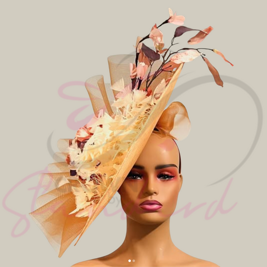 Glamorous peachy orange color fascinator with, feathers, and a flower!