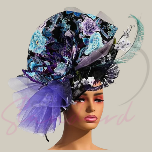 This gorgeous fascinator has a huge handmade flower, as well as a handmade gathered trim with crinoline, and feathers!