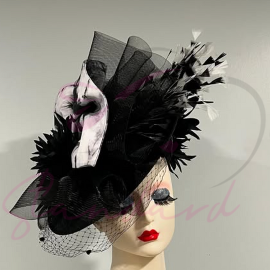 Limited edition fascinator with tie-dye fabric, crinoline, feathers, and a flower!